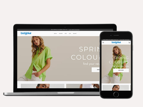 Laptop and iPhone screen showing Bodyblue Shopify website design by Fashioncan. 